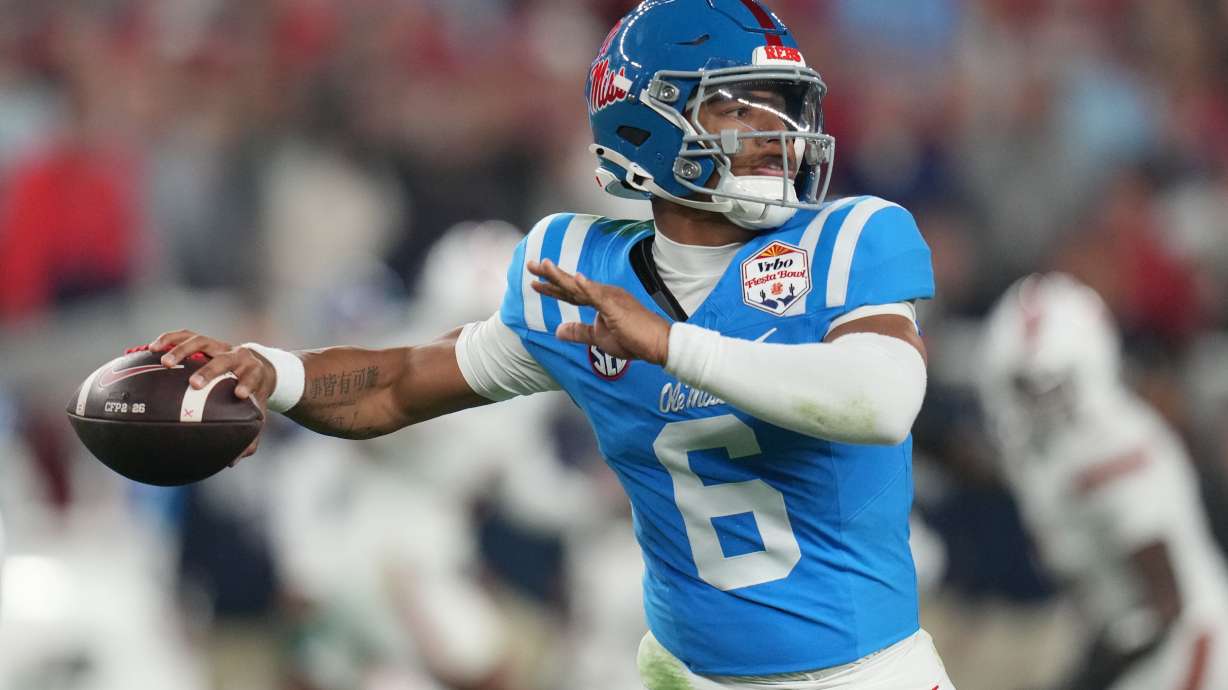 FILE - Mississippi quarterback Trinidad Chambliss throws during the first half of the Fiesta Bowl NCAA college football playoff semifinal game against Miami, Jan. 8, 2026, in Glendale, Ariz.