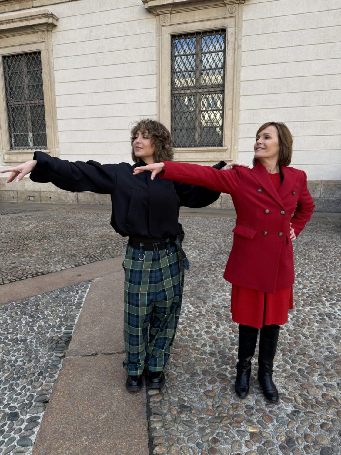 Randi Strong demonstrates finishing a line with KSL's Deanie Wimmer on Wednesday. Strong said finishing a line or subtle body movements can make a big difference in competition.