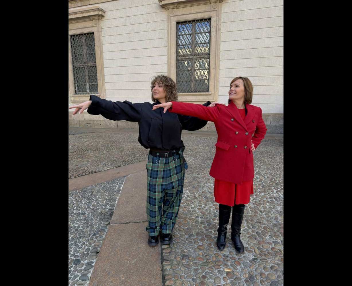 Randi Strong demonstrates finishing a line with KSL's Deanie Wimmer on Wednesday. Strong said finishing a line or subtle body movements can make a big difference in competition.