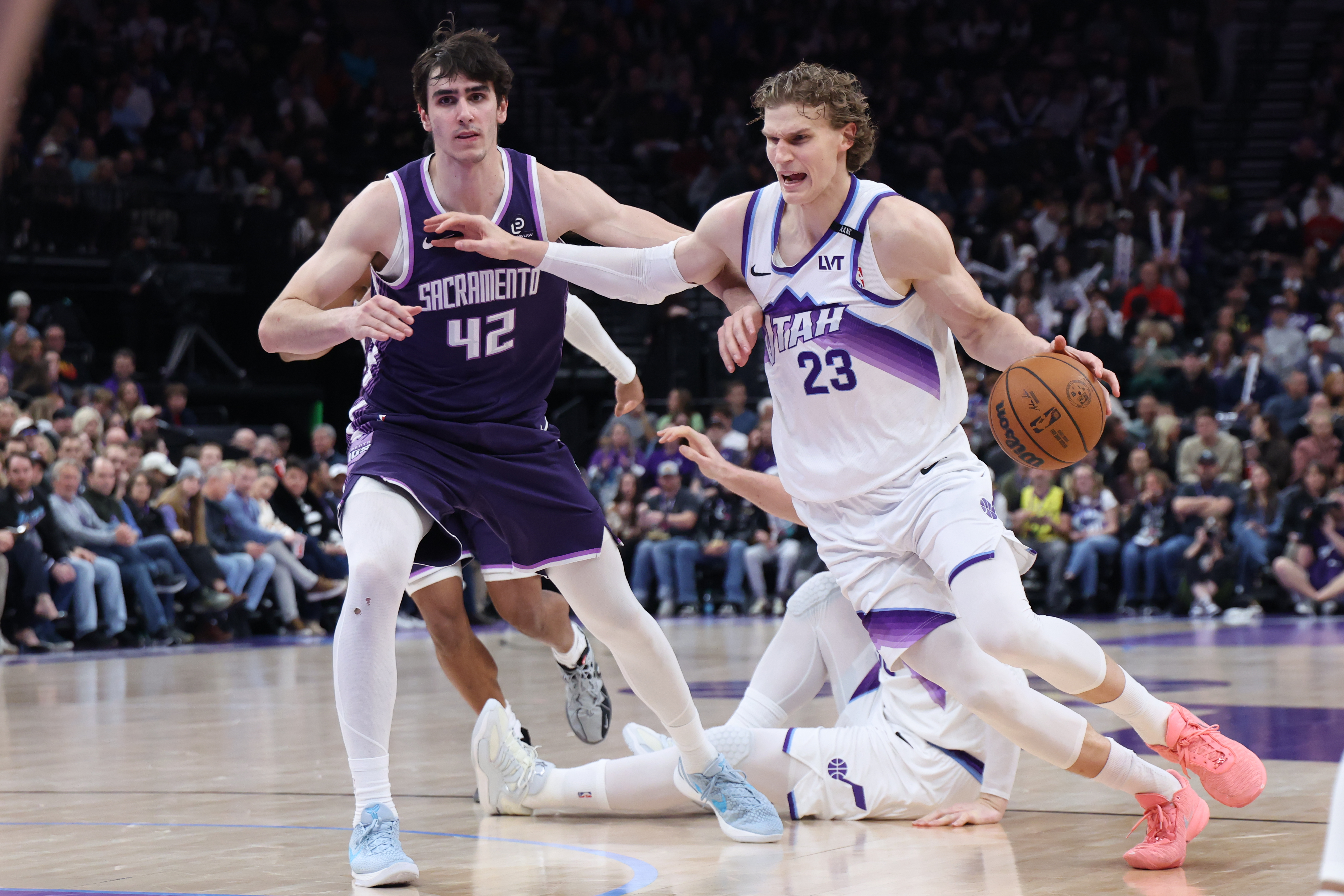 Utah Jazz forward Lauri Markkanen (23) drives to the basket against Sacramento Kings center Maxime Raynaud (42) during the second half of an NBA basketball game, Wednesday, Feb. 11, 2026, in Salt Lake City. 