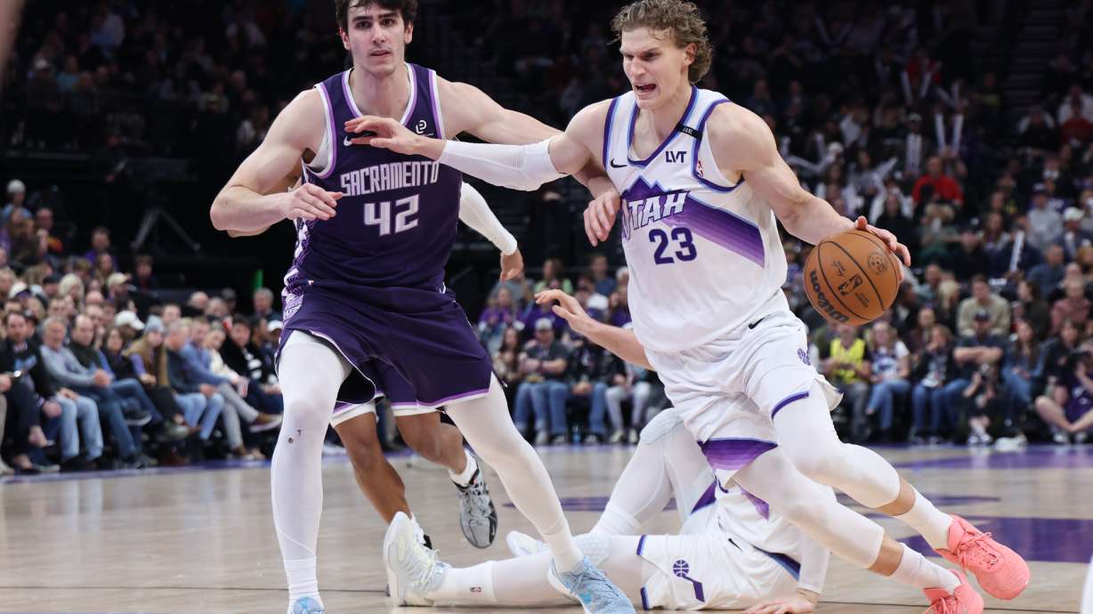 Utah Jazz forward Lauri Markkanen (23) drives to the basket against Sacramento Kings center Maxime Raynaud (42) during the second half of an NBA basketball game, Wednesday, Feb. 11, 2026, in Salt Lake City.