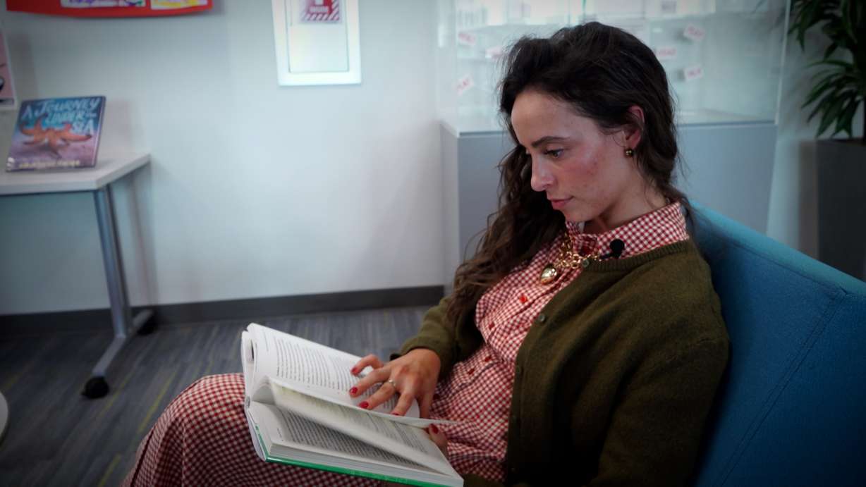 Maddy Tolman reads a book at home, part of the "Analog Bag Challenge," Thursday. The challenge meant Tolman put her phone down for 48 hours and kept herself busy with an "analog bag" instead.