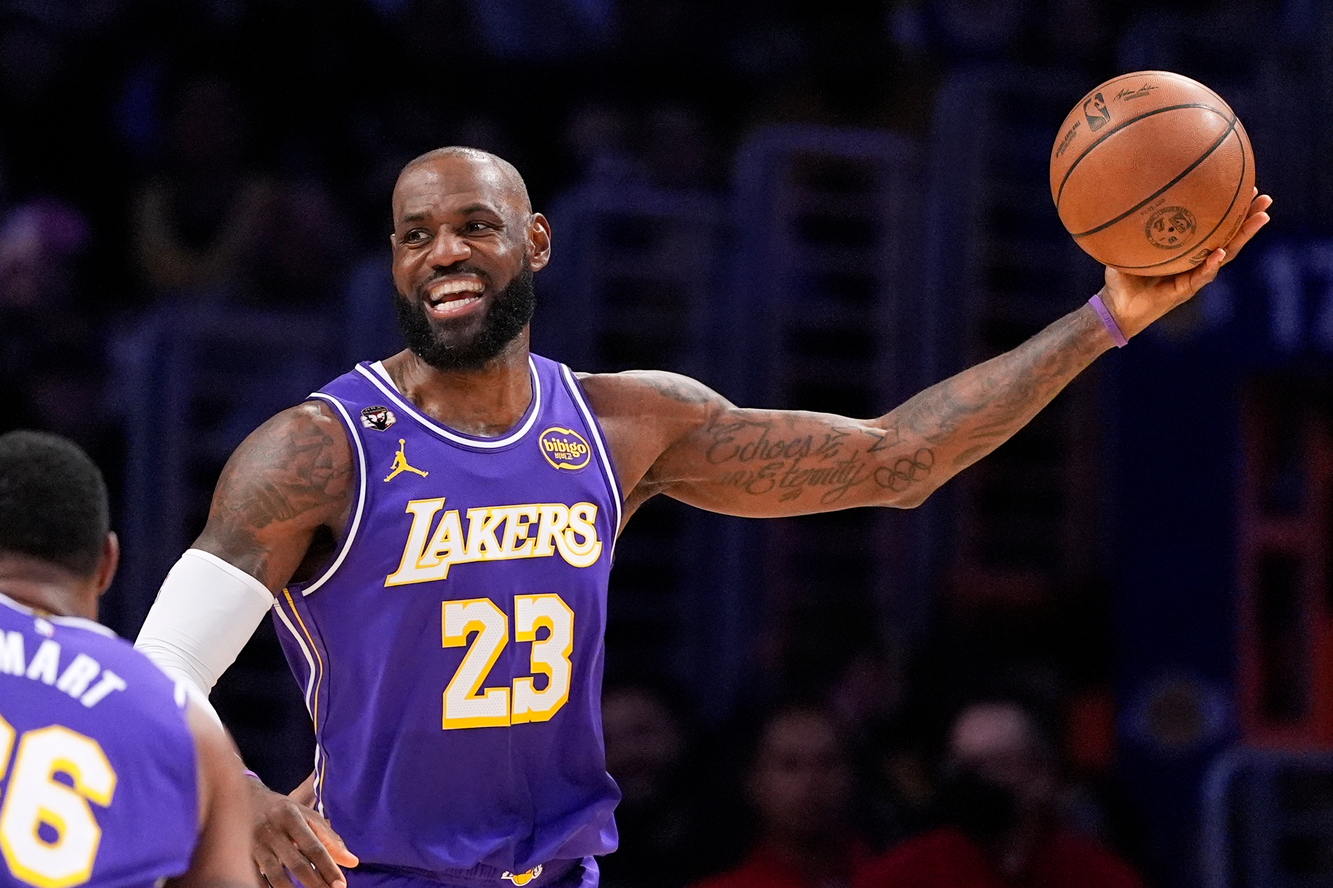 Los Angeles Lakers forward LeBron James smiles as he tries to pass during the first half of an NBA basketball game against the Dallas Mavericks, Thursday, Feb. 12, 2026, in Los Angeles.