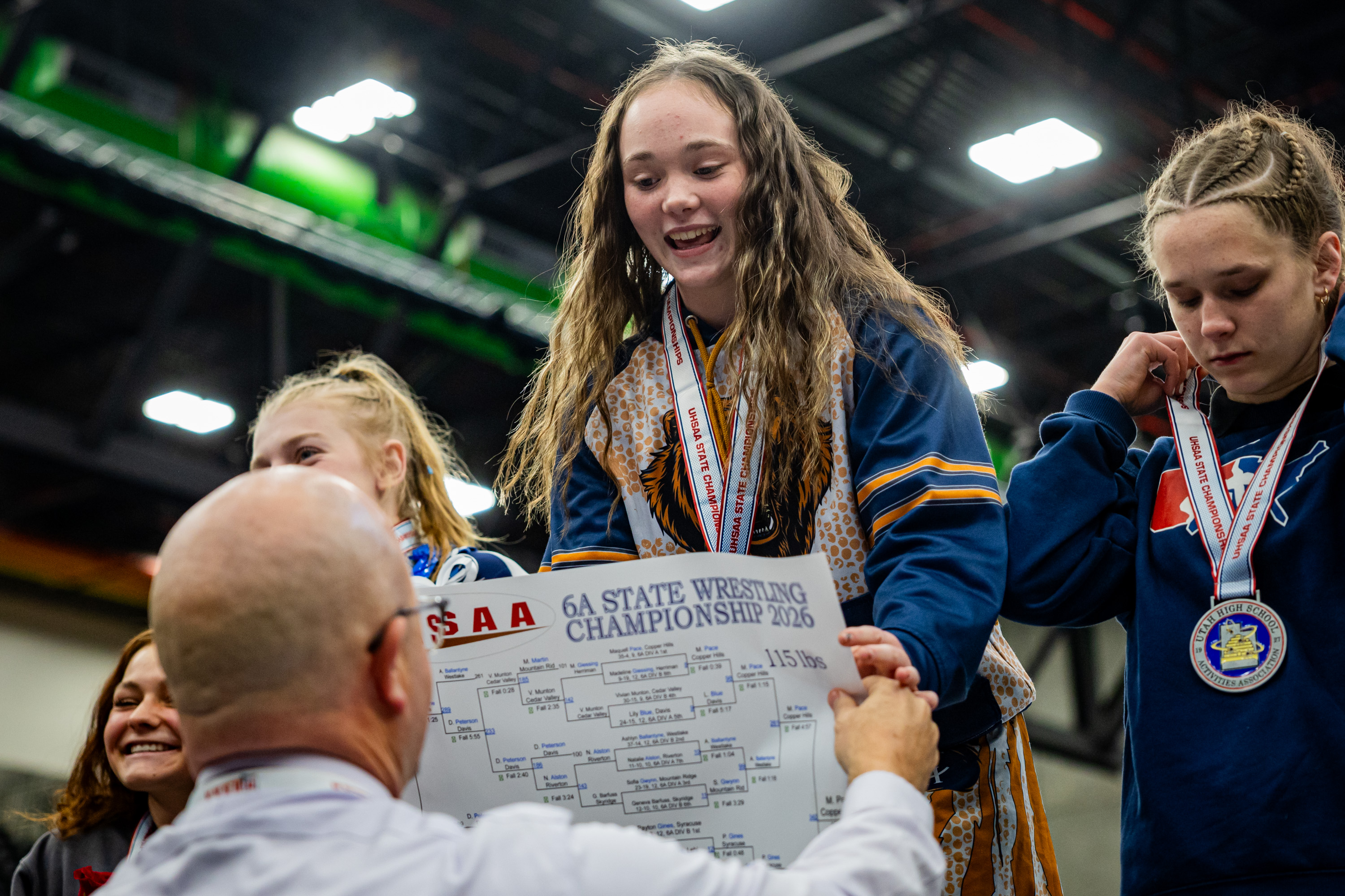 Maquell Pace, Copper Hills, center, wins first place in the 6A girls wrestling state championships 115-pound class at the UCCU Center in Orem on Thursday, Feb. 12, 2026.
