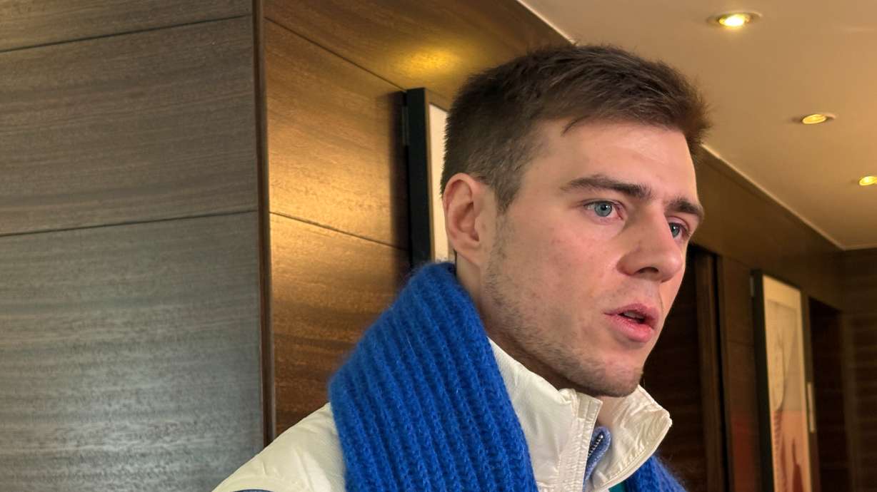 Ukrainian skeleton athlete Vladyslav Heraskevych speaks to the media amid an ongoing appeal hearing in Milan, Italy, Friday. His appeal was denied a few hours after the hearing.