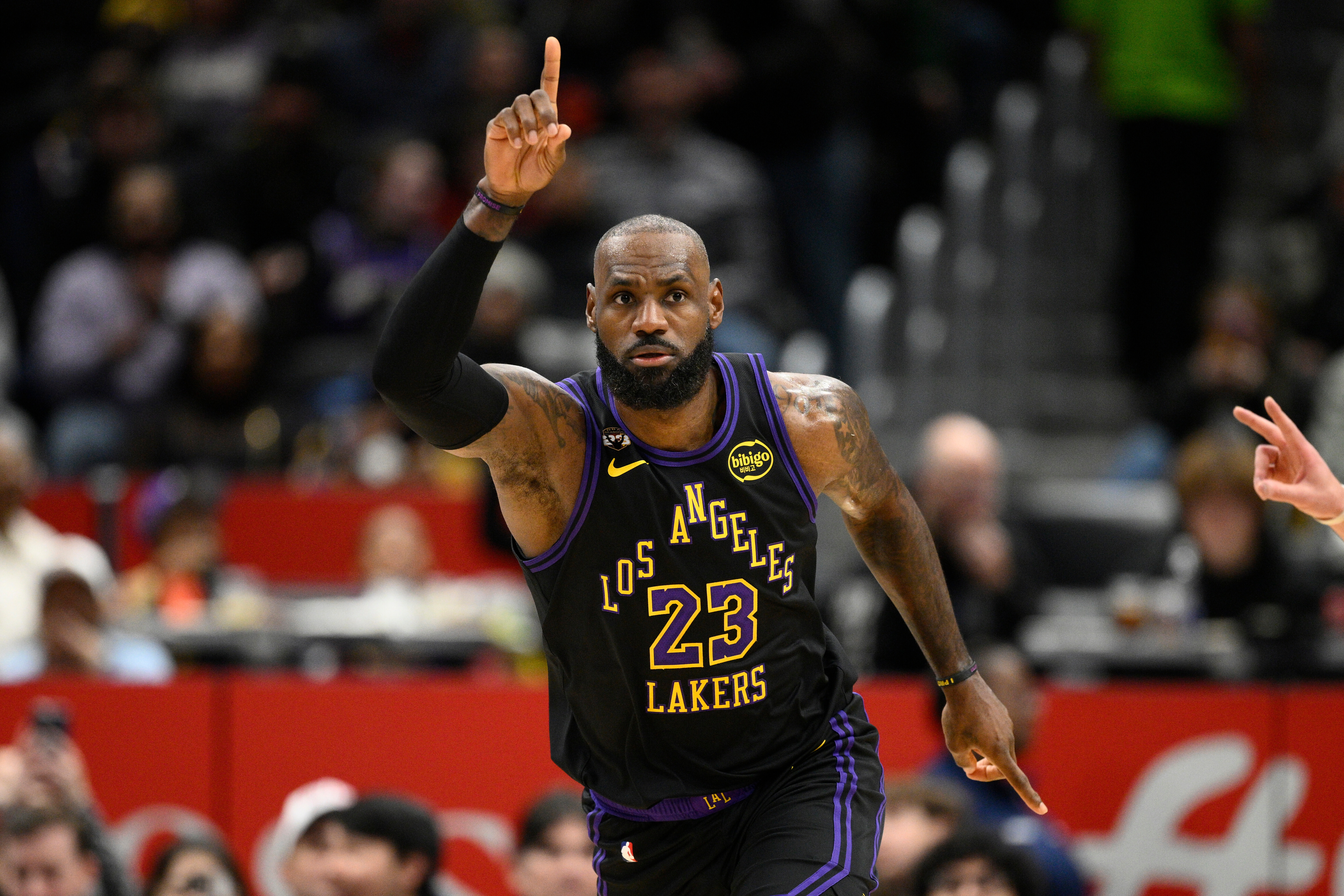 Los Angeles Lakers forward LeBron James gestures after he scored during the first half of an NBA basketball game against the Washington Wizards, Friday, Jan. 30, 2026, in Washington. 