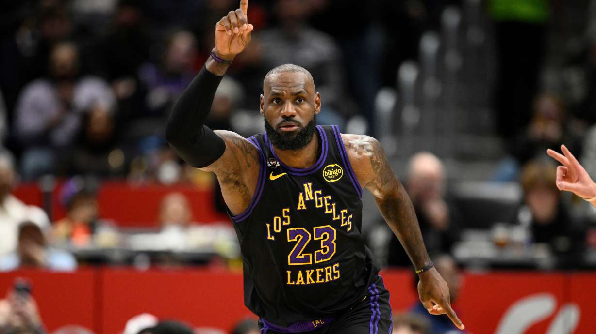 Los Angeles Lakers forward LeBron James gestures after he scored during the first half of an NBA basketball game against the Washington Wizards, Friday, Jan. 30, 2026, in Washington.