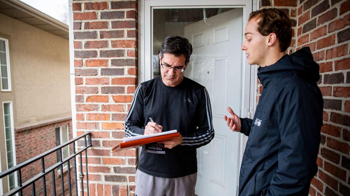 Riley Beesley talks to Nicasio Perna about the petition to repeal Proposition 4 at Union Park in Midvale on Thursday. Utahns for Representative Government asked the Utah Supreme Court on Wednesday to extend the signature submission deadline.