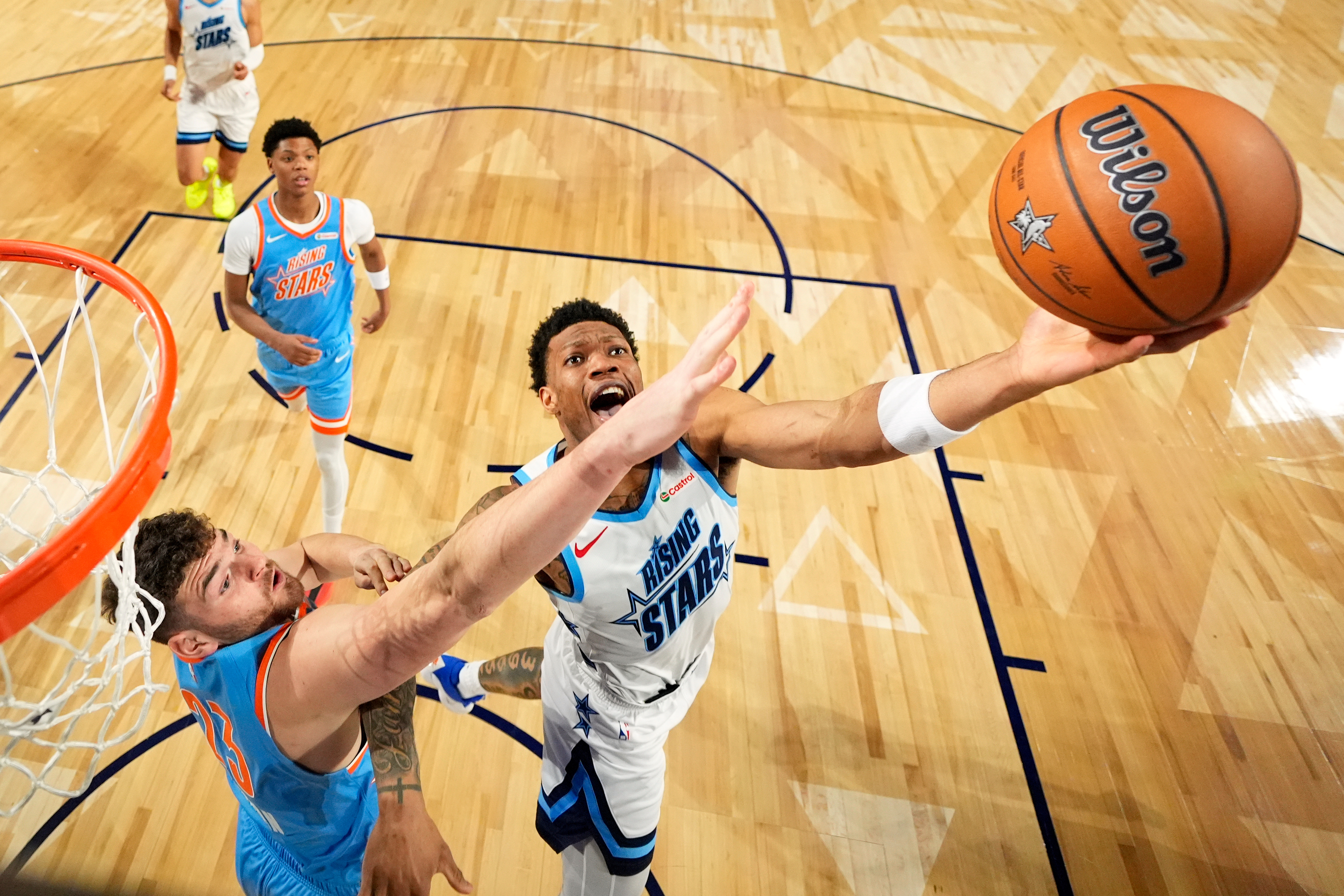 Team Austin guard Alijah Martin (55) of the Toronto Raptors, right, shoots as Team Melo frontcourt Donovan Clingan (23) of the Portland Trail Blazers defends during an NBA basketball's Rising Stars event Friday, Feb. 13, 2026, in Inglewood, Calif. 