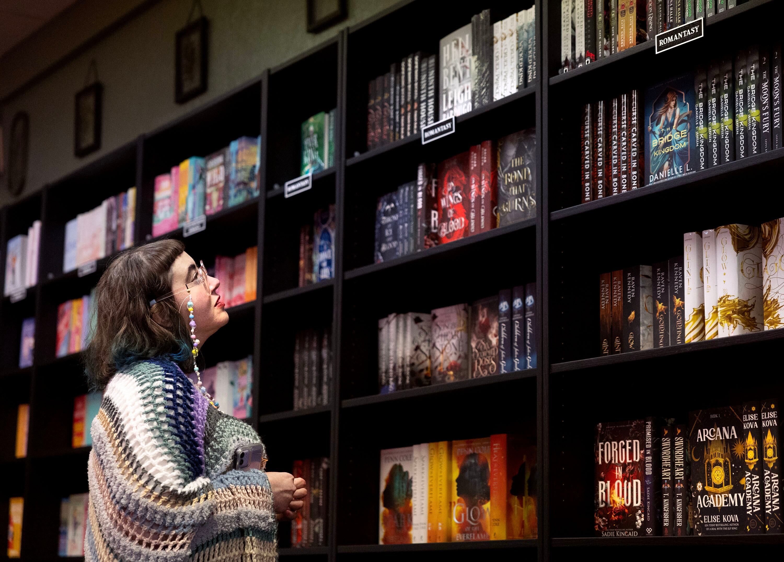 Astra Hess of Ogden shops at The Romantics Archive in Ogden on Wednesday.