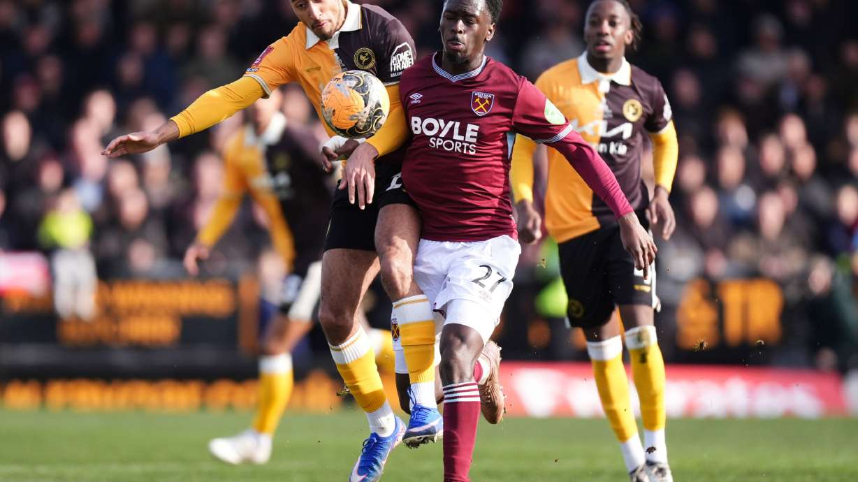 Burton Albion's Kain Adom, left, and West Ham United's Soungoutou Magassa in action during the English FA Cup fourth round soccer match between Burton Albion and West Ham United in Burton upon Trent, England, Saturday Feb. 14, 2026.