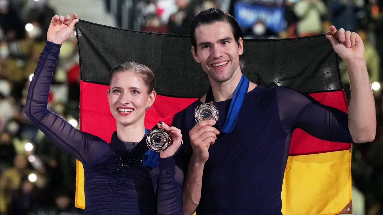 Minerva Fabienne Hase and Nikita Volodin, of Germany, after winning the bronze medal in the pairs competition at the ISU Grand Prix of Figure Skating Final in Nagoya, central Japan, Friday, Dec. 5, 2025.
