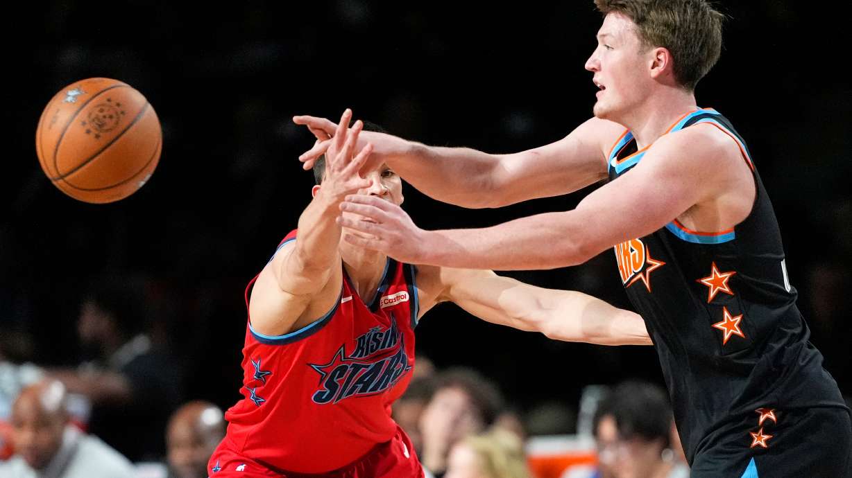Team T-Mac guard Kon Knueppel (7) of the Charlotte Hornets, right, passes while under pressure from Team Vince guard Egor Demin (8) of the Brooklyn Nets during an NBA basketball's Rising Stars event Friday, Feb. 13, 2026, in Inglewood, Calif.