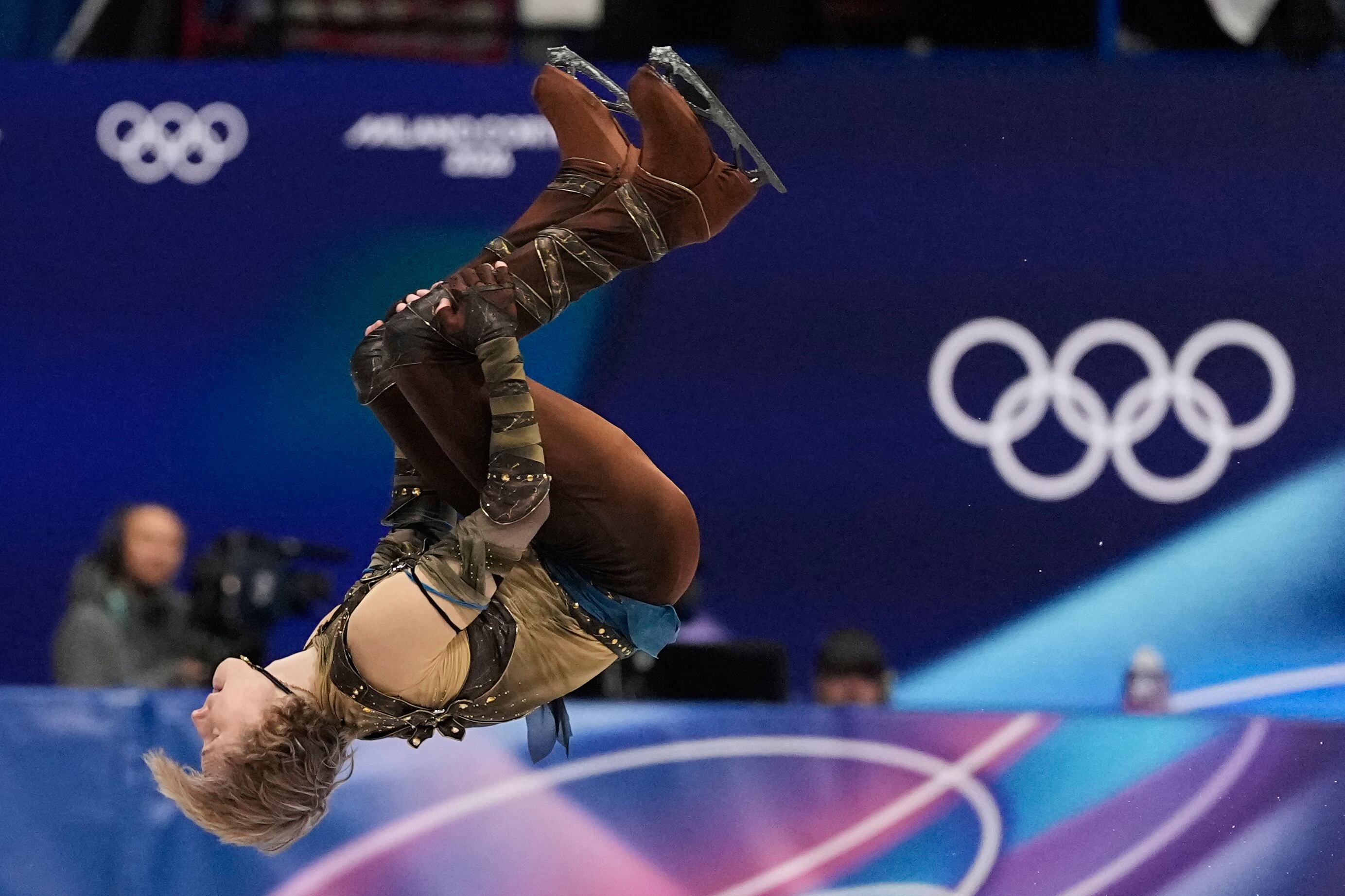 Ilia Malinin of the United States does a back flip while competing during the men's figure skating short program at the 2026 Winter Olympics, in Milan, Italy, Tuesday.