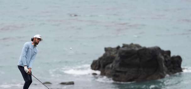 Bhatia's big birdie runs helps him beat the wind and lead at Pebble Beach