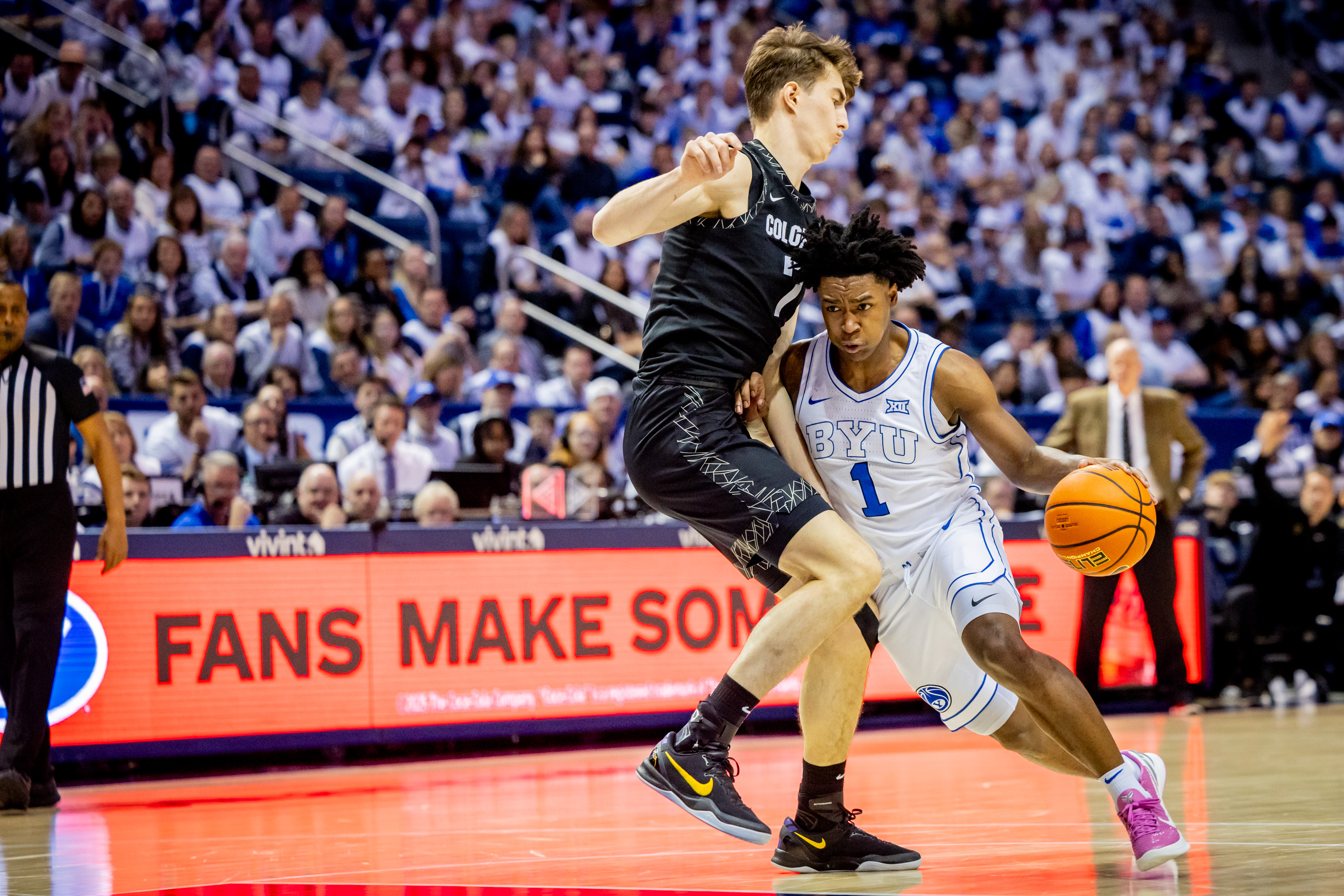 BYU guard Robert Wright III (1) drives the ball toward the basket during a game against the Colorado Buffaloes at the Marriott Center in Provo on Saturday, Feb. 14, 2026.