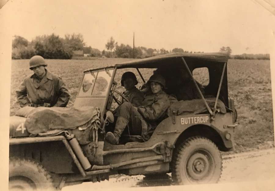 Then-U.S. Army Staff Sgt. Bill Hulet and his comrades travel in a Jeep during World War II. Hulet was part of a convoy known as the "Red Ball Express."