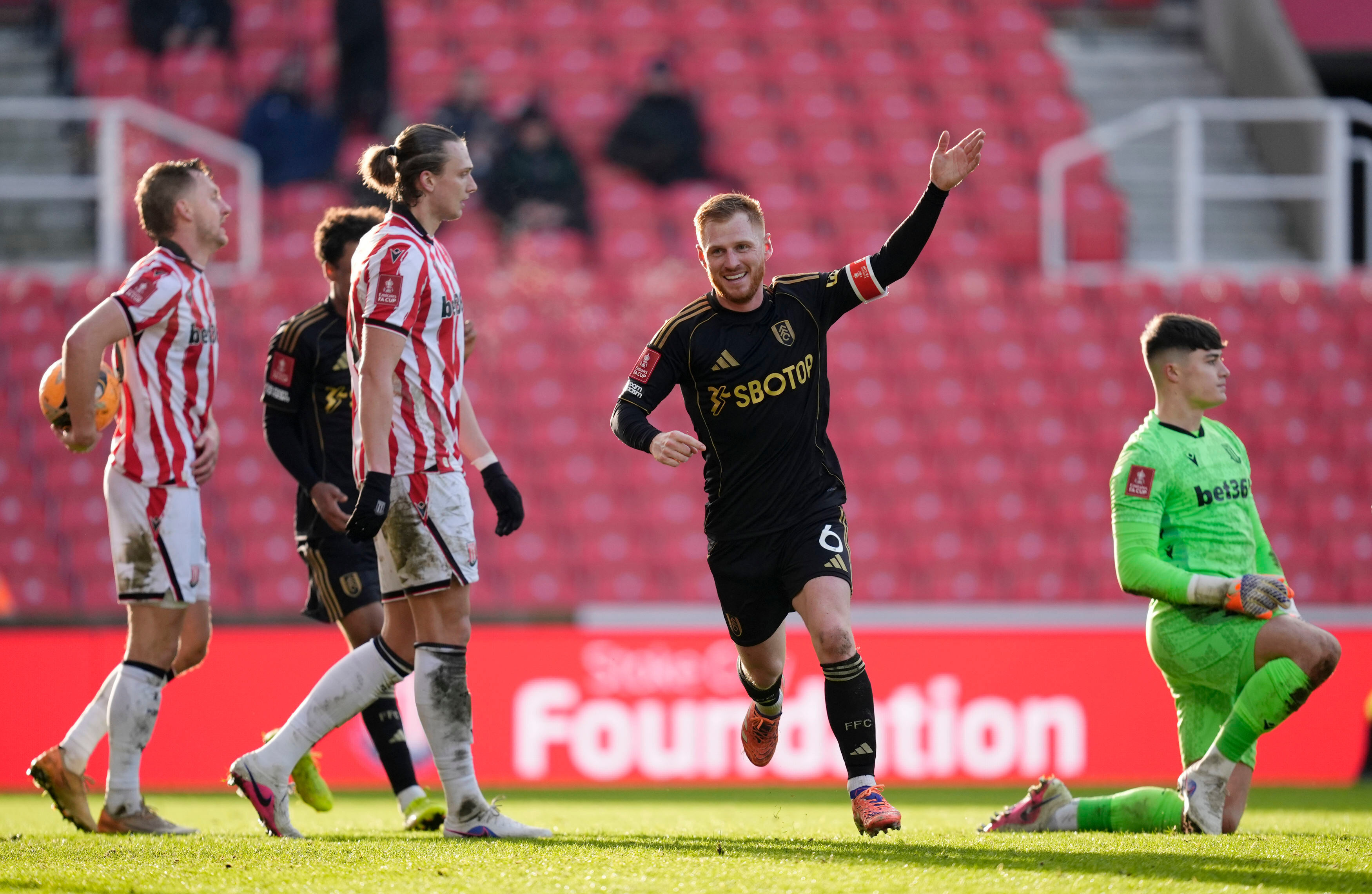 Fulham's Harrison Reed celebrates after scoring his sides second goal during the English FA Cup fourth round match between Stoke City and Fulham, in Stoke, England, Sunday, Feb. 15, 2026. 