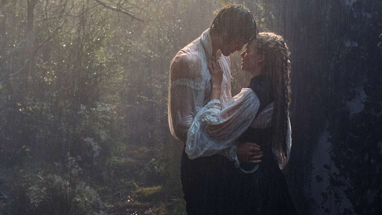This image released by Warner Bros. Pictures shows Margot Robbie, right, and Jacob Elordi in a scene from "Wuthering Heights."