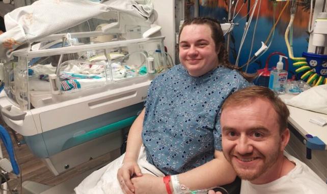 Jacob, Anna and Logan Ames hours after Logan was born.