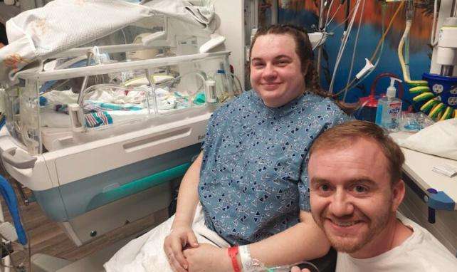 Jacob, Anna and Logan Ames hours after Logan was born.