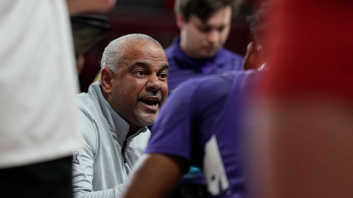 Kansas State head coach Jerome Tang talks to his players during a timeout during the first half of an NCAA college basketball game against Houston, Saturday, Feb. 14, 2026, in Houston.