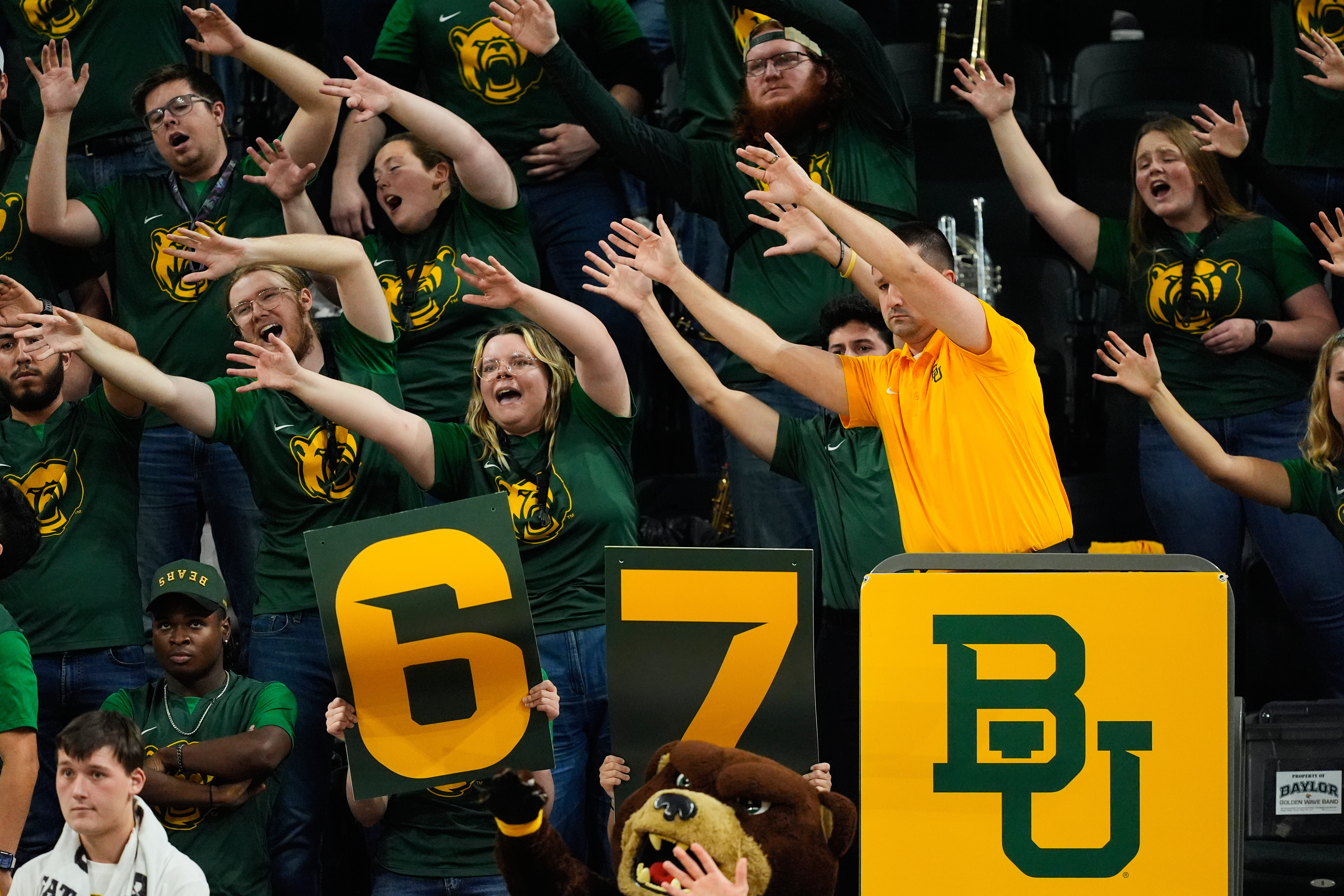 FILE - Baylor fans holding up a 6-7 sign cheer during an NCAA college basketball game against BYU, Feb. 10, 2026, in Waco, Texas. 