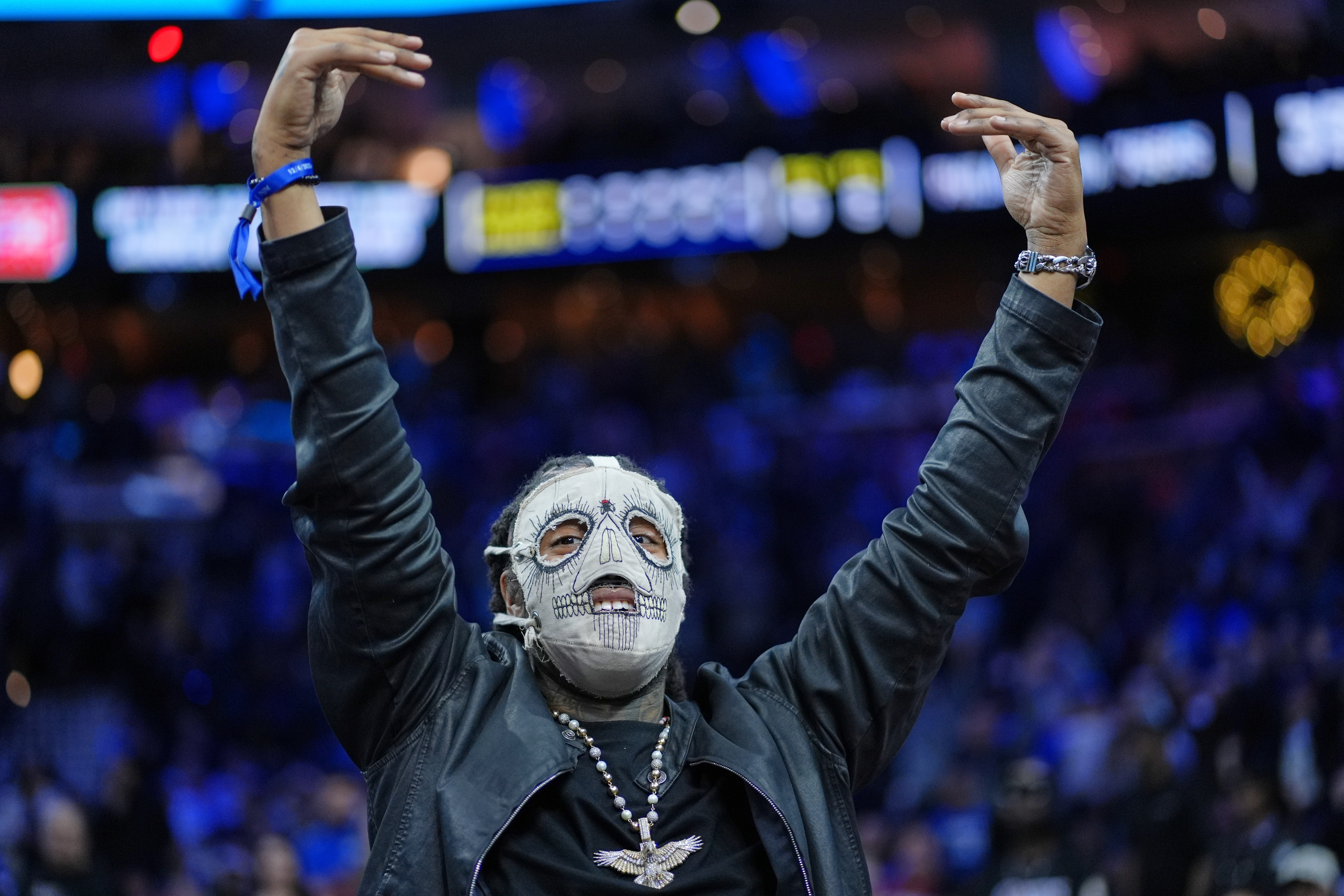 FILE - Rapper Skrilla reacts during an NBA basketball game Thursday, Dec. 4, 2025, in Philadelphia. 