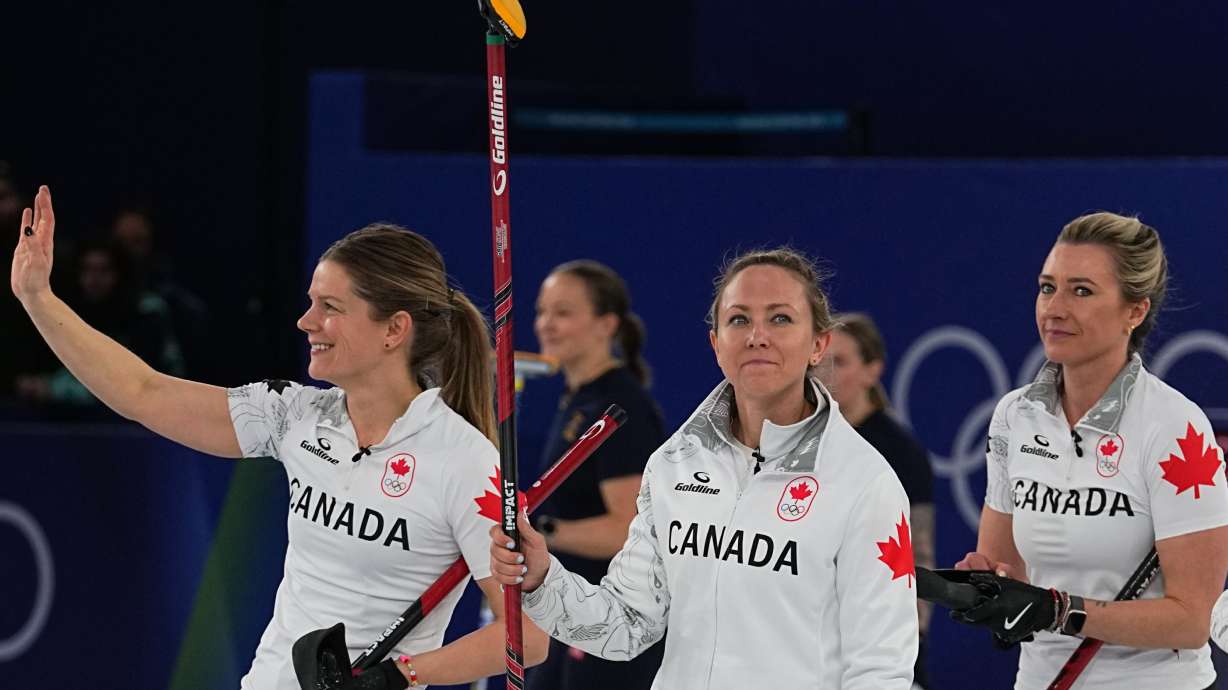 Canada's Rachel Homan, Sarah Wilkes and Emma Miskew react after the women's curling round robin session against China at the 2026 Winter Olympics, in Cortina d'Ampezzo, Italy, Monday, Feb. 16, 2026.