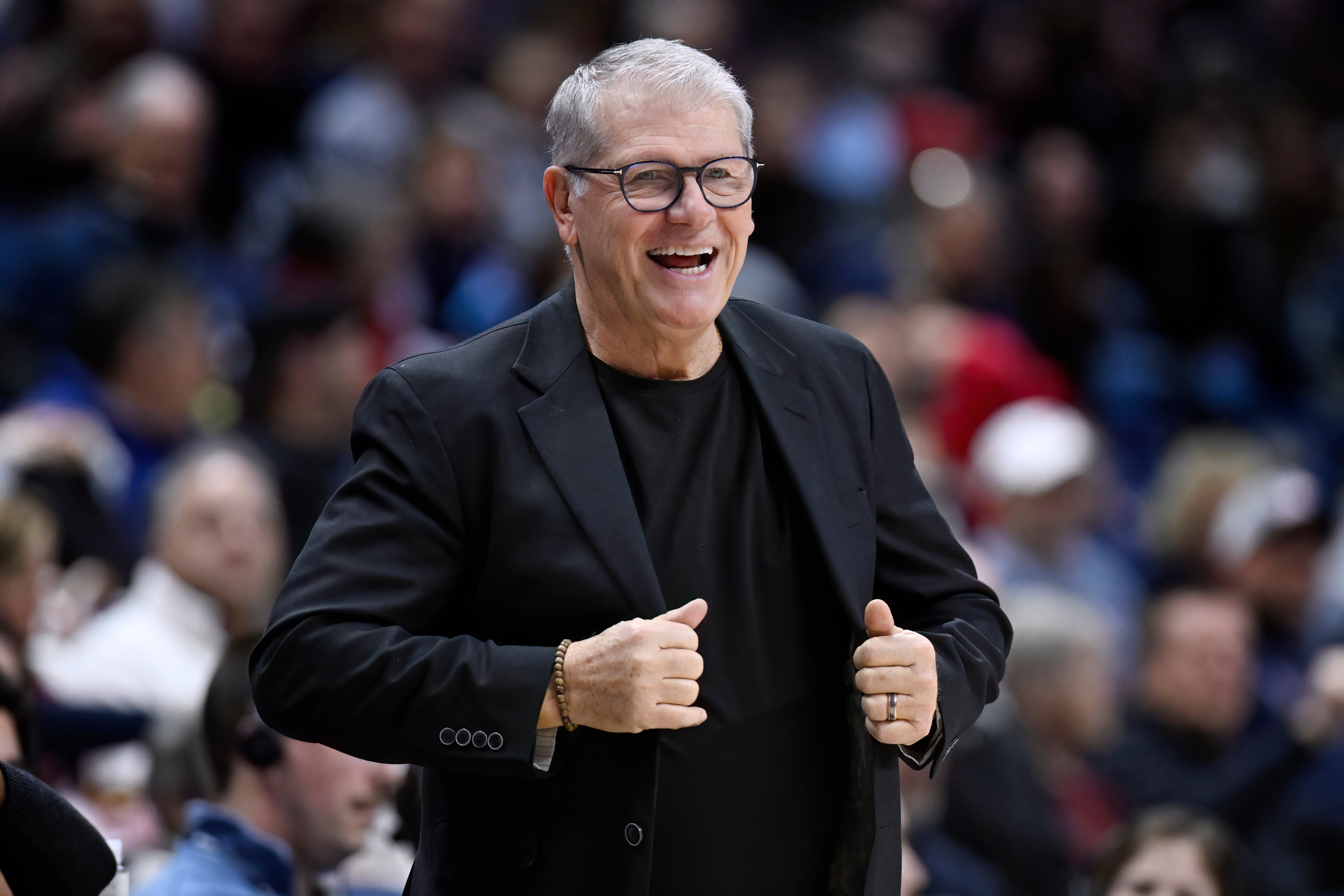 UConn head coach Geno Auriemma smiles in the first half of an NCAA college basketball game against Creighton, Wednesday, Feb. 11, 2026, in Storrs, Conn. 