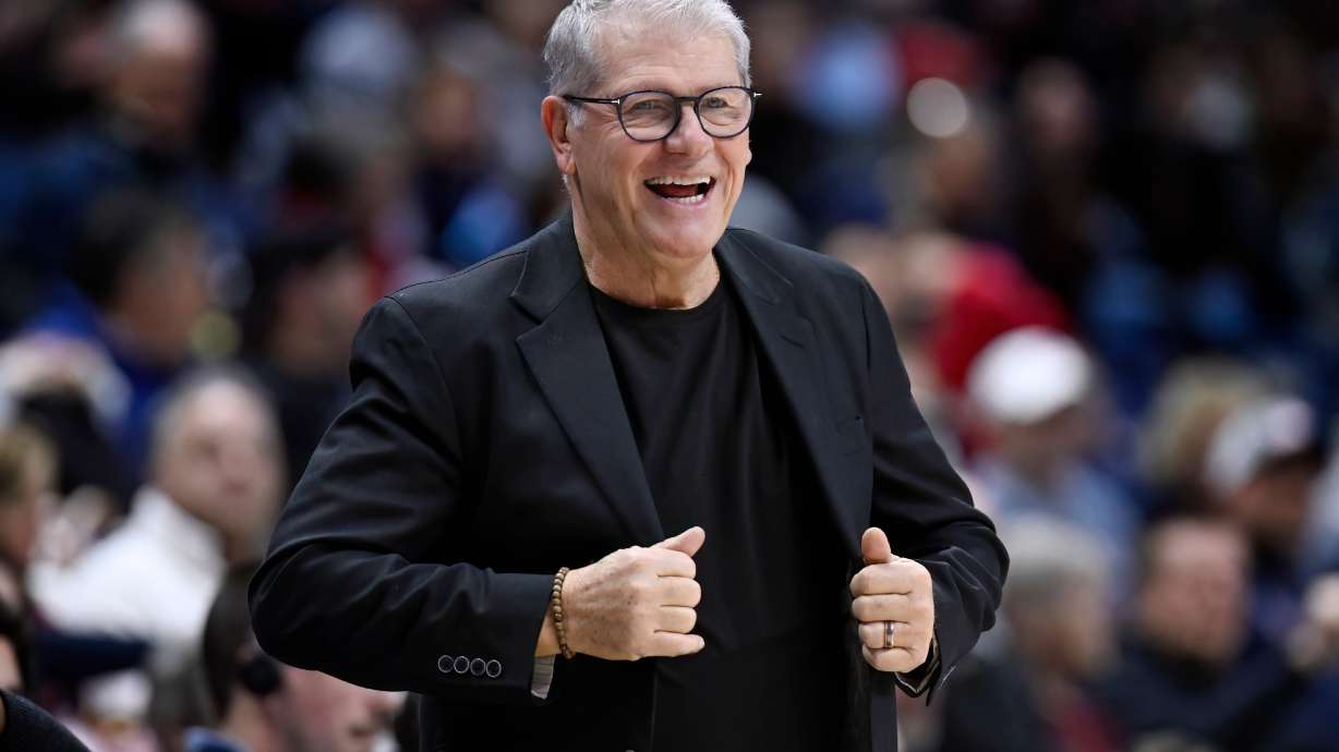 UConn head coach Geno Auriemma smiles in the first half of an NCAA college basketball game against Creighton, Wednesday, Feb. 11, 2026, in Storrs, Conn.