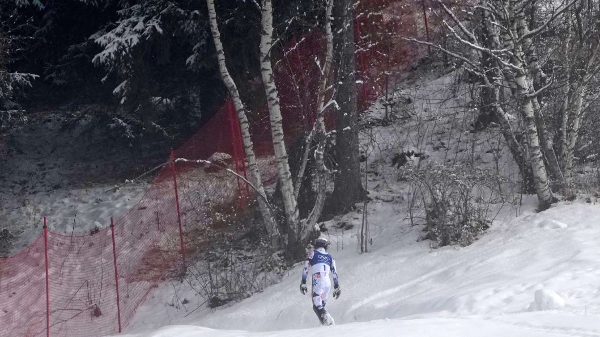Norway's Atle Lie McGrath walks off the course after skiing out during an alpine ski, men's slalom race, at the 2026 Winter Olympics, in Bormio, Italy, Monday, Feb. 16, 2026.