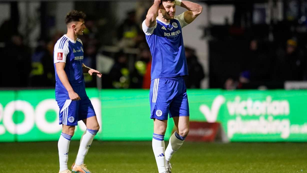 Macclesfield's Sam Heathcote reacts after scoring own goal during the English FA cup fourth round soccer match between Macclesfield and Brentford in Macclesfield, England, Monday, Feb. 16, 2026.