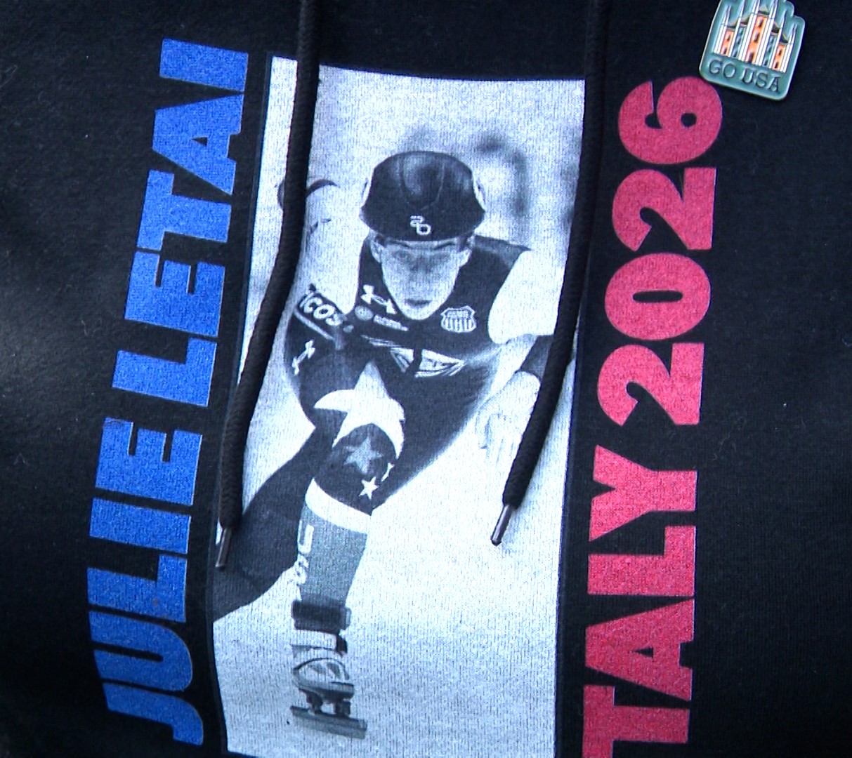 Jean Latai wears her hoodie supporting her daughter, speedskater Julie Latai, Monday. Jean Latai said she gets a workout in every time Julie Latai competes.