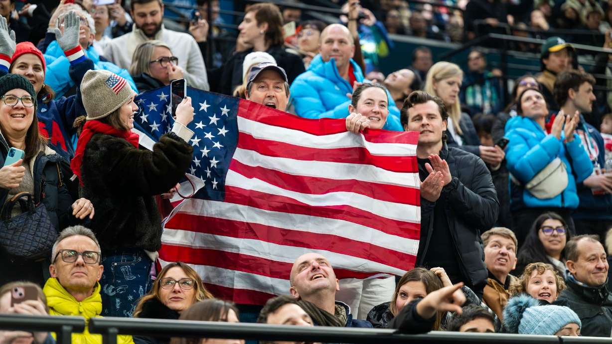 Fans cheer as USA women’s hockey players celebrate after scoring a goal as they and Switzerland play at Milano Rho Ice Hockey Arena in Preliminary Round-Group A action at the 2026 Milan Cortina Winter Olympics in Milan, Italy, on Feb. 10.