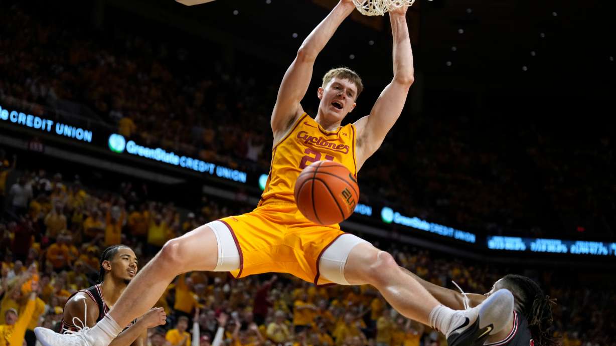 Iowa State forward Dominykas Pleta dunks over Houston forward Joseph Tugler (11) during the second half of an NCAA college basketball game, Monday, Feb. 16, 2026, in Ames, Iowa.