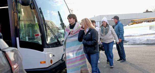 Police credit a good Samaritan for ending a deadly shooting at a Rhode Island ice rink