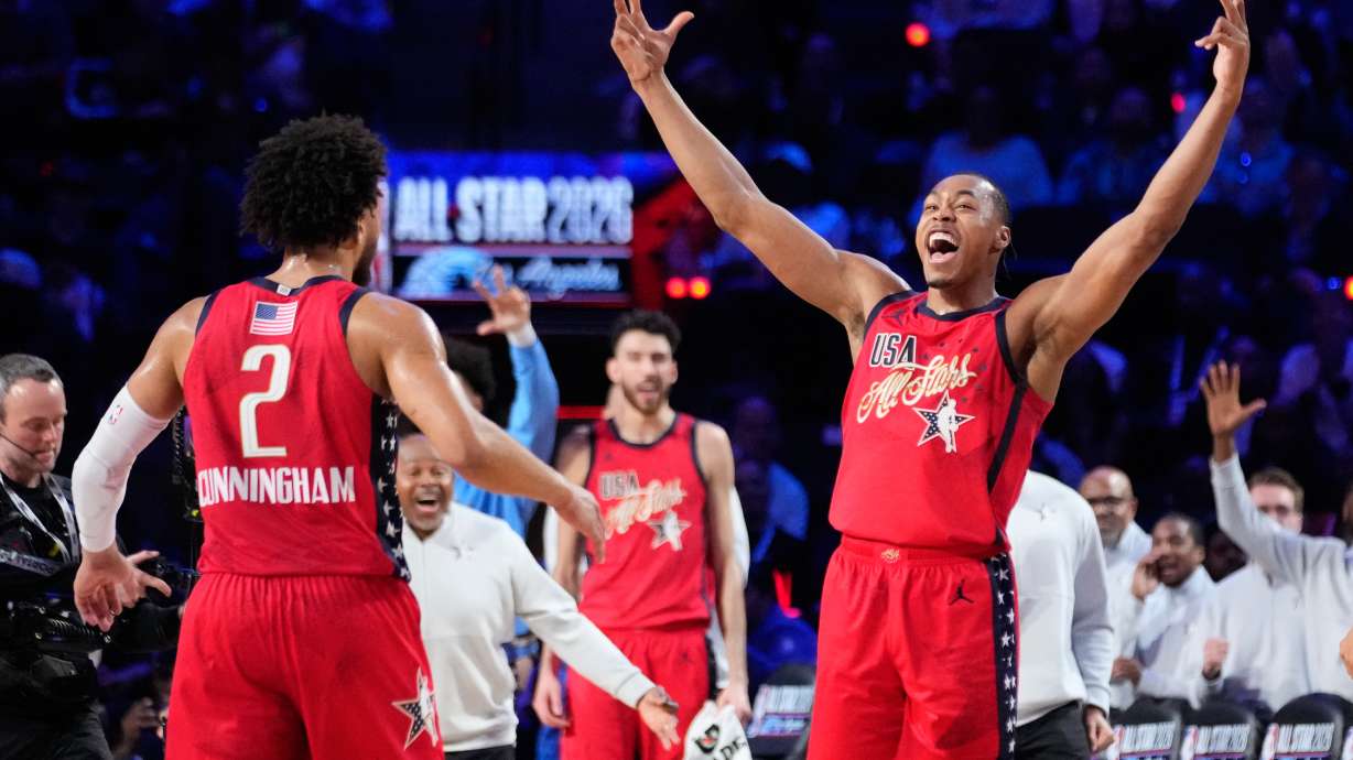 USA Stars forward Scottie Barnes, center, celebrates with guard Cade Cunningham after a win over World during the NBA All-Star basketball game Sunday, Feb. 15, 2026, in Inglewood, Calif.