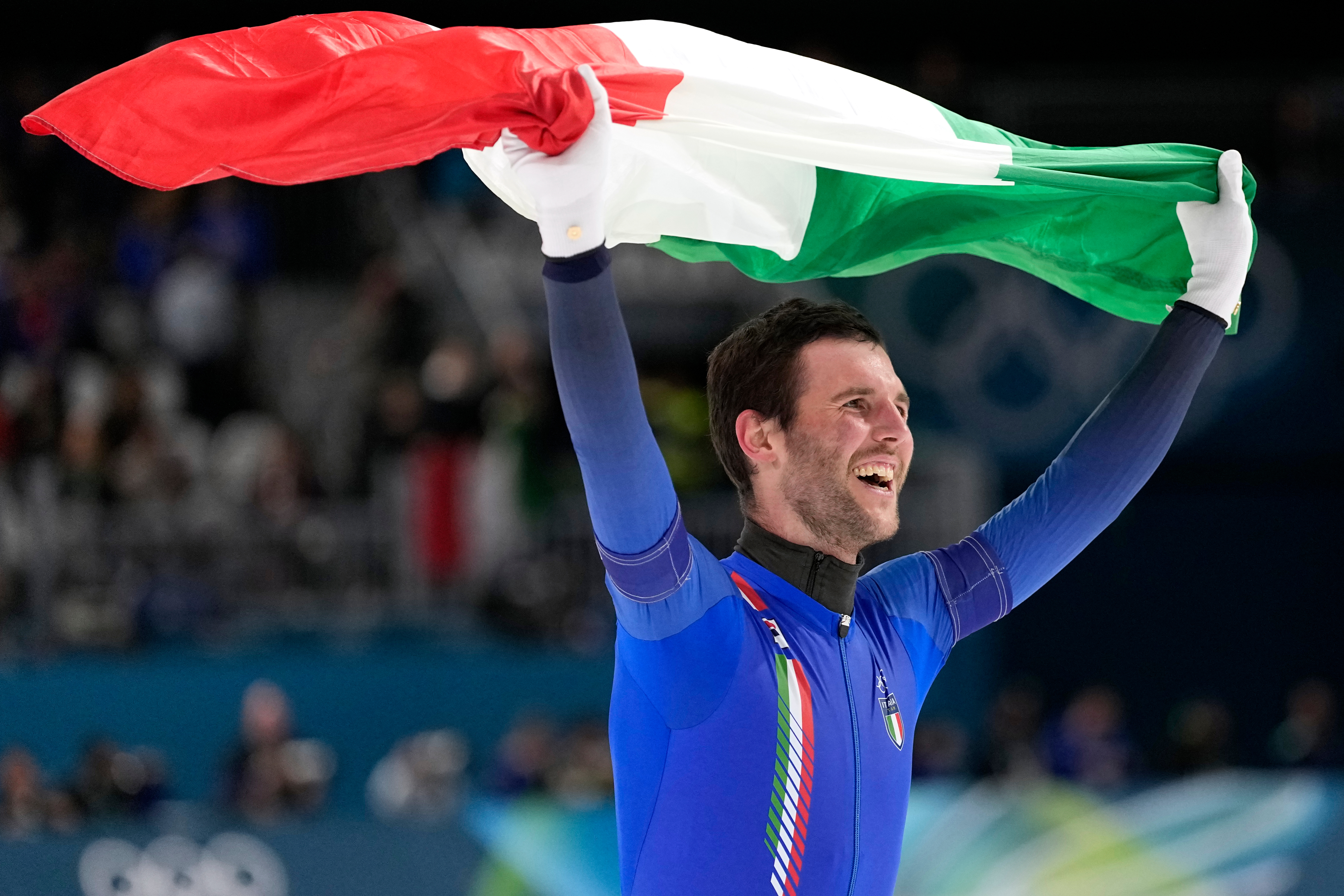 Team Italy's Michele Malfatti celebrates winning the gold medal in the final of the men's team pursuit speedskating race at the 2026 Winter Olympics, in Milan, Italy, Tuesday, Feb. 17, 2026. 