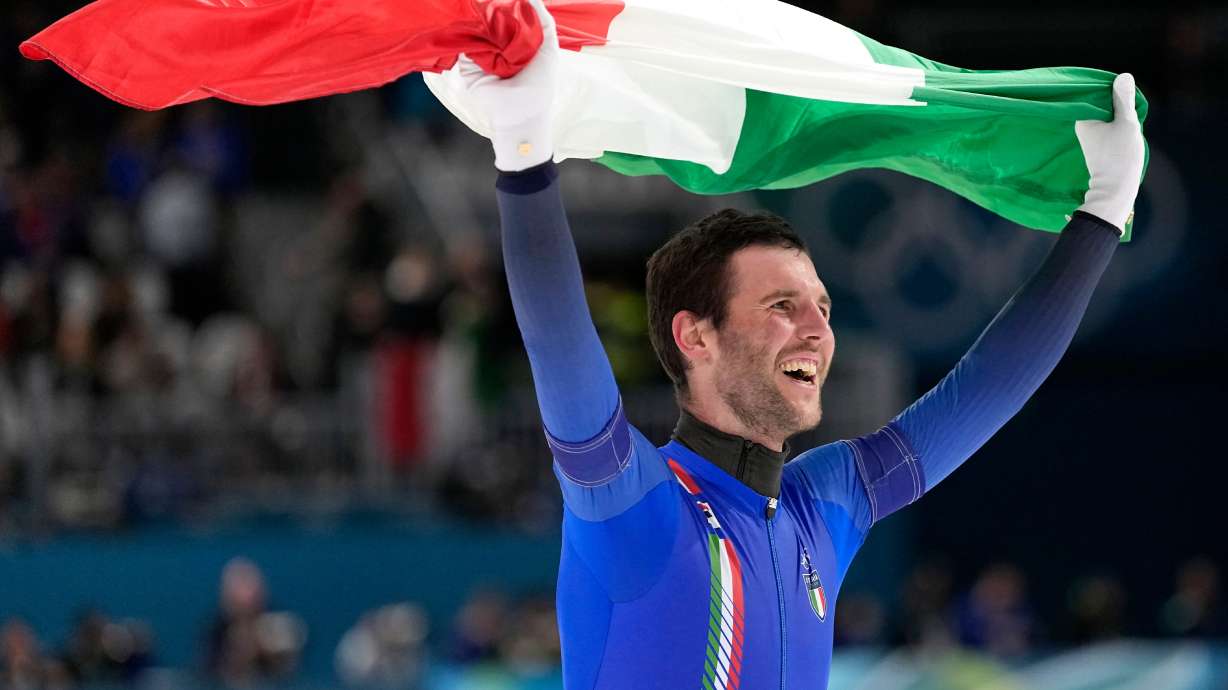 Team Italy's Michele Malfatti celebrates winning the gold medal in the final of the men's team pursuit speedskating race at the 2026 Winter Olympics, in Milan, Italy, Tuesday, Feb. 17, 2026.