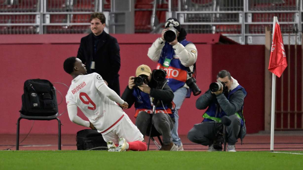 Monaco's Folarin Balogun celebrates after scoring the opening goal during the first-leg of the Champions League playoff soccer match between Monaco and Paris Saint-Germain in Monaco, Tuesday, Feb. 17, 2026.