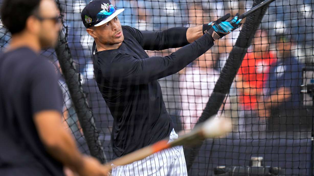 New York Yankees' Giancarlo Stanton takes batting practice during a spring training baseball workout Monday, Feb. 16, 2026, in Tampa, Fla.