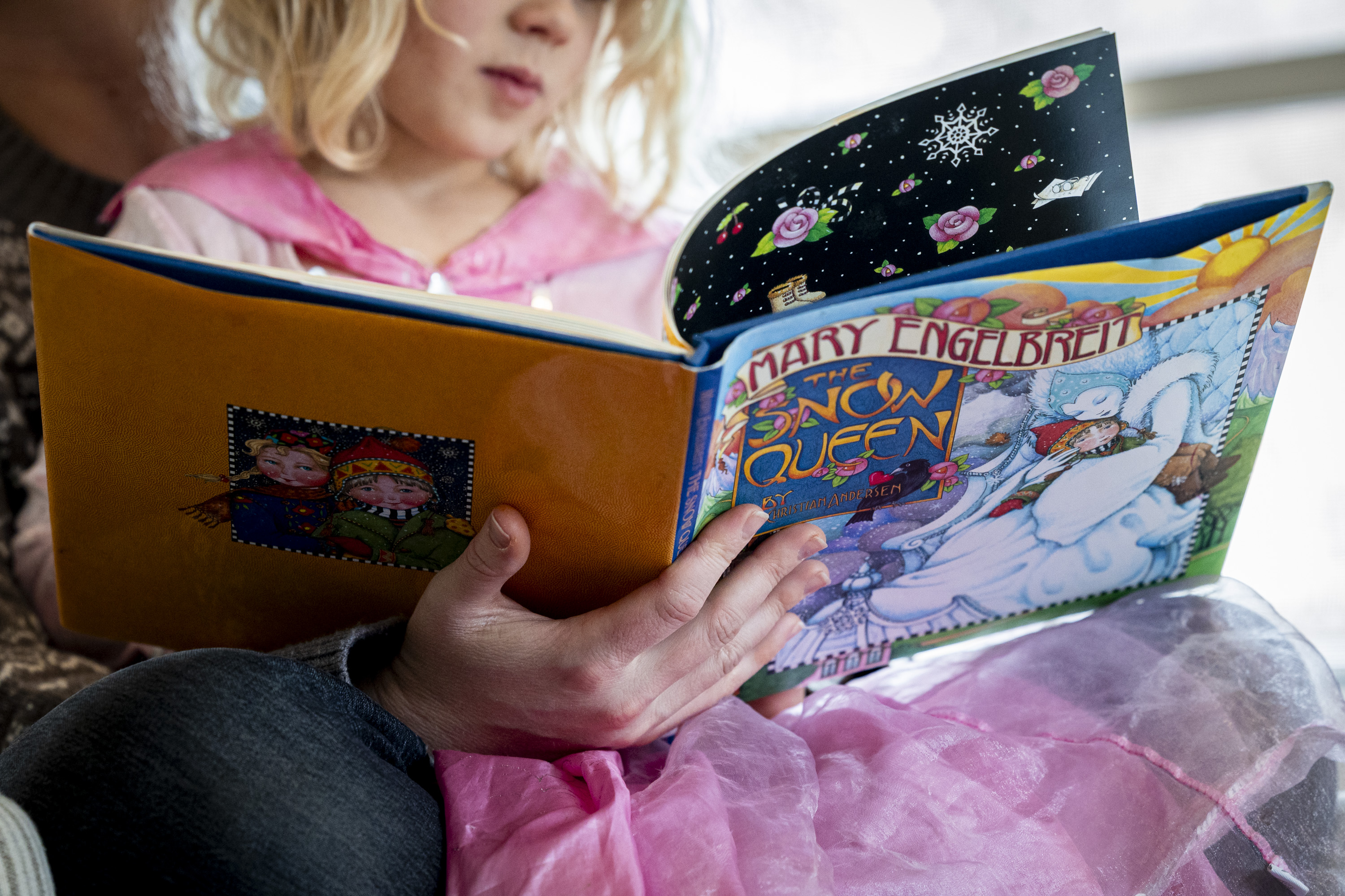 Rhiannon McDaniel reads to her daughter Brita, 4, at her family’s home in Holladay on Wednesday. Lawmakers are introducing numerous measures to combat rising child care costs in the state.