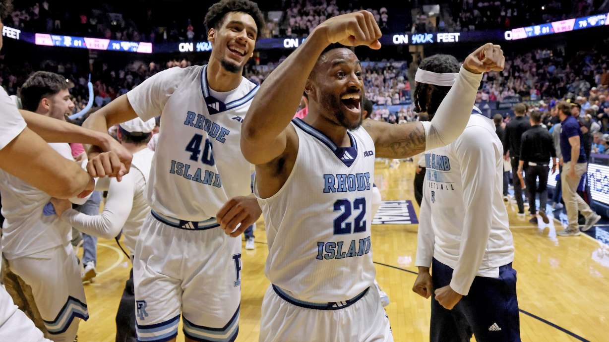 Rhode Island guard RJ Johnson (22) and forward Keeyan Itejere (40) celebrate their win over Saint Louis in an NCAA college basketball game, Tuesday, Feb. 17, 2026, in South Kingstown, R.I.