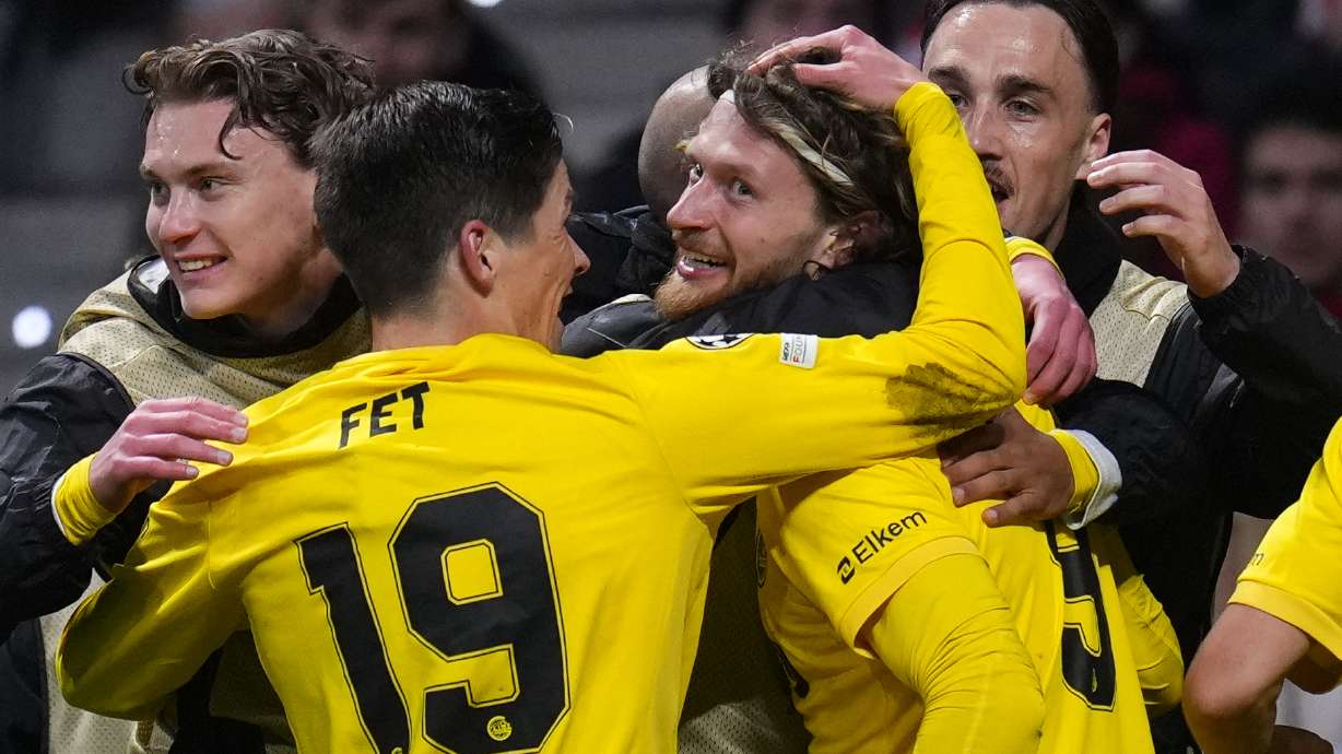 Glimt's Kasper Hogh, center, celebrates after scoring his side's second goal during the Champions League opening phase soccer match between Atletico Madrid and Bodo Glimt in Madrid, Spain, Wednesday, Jan. 28, 2026.
