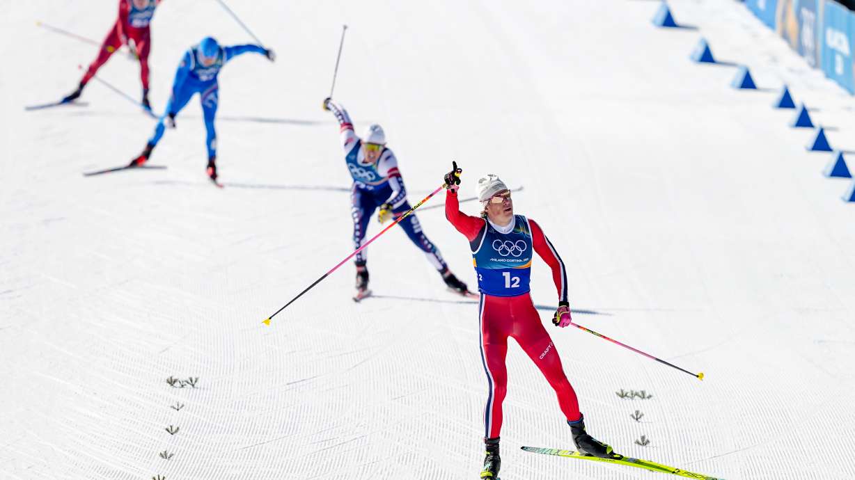 Johannes Hoesflot Klaebo, of Norway, approaches the finish line to win the gold medal in the cross-country skiing men's team sprint free at the 2026 Winter Olympics, in Tesero, Italy, Wednesday, Feb. 18, 2026.
