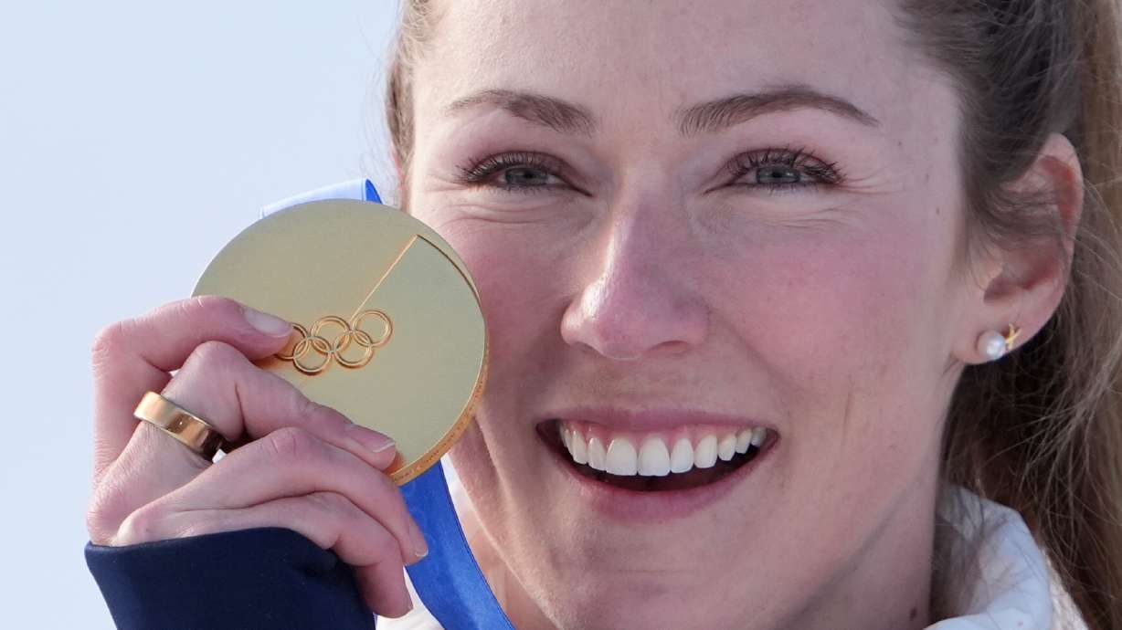 United States' Mikaela Shiffrin celebrates winning the gold medal in an alpine ski, women's slalom race, at the 2026 Winter Olympics, in Cortina d'Ampezzo, Italy, Wednesday, Feb. 18, 2026.