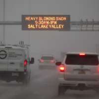 Heavy snow causes delays at airport, snow squall warnings and canyon restrictions
