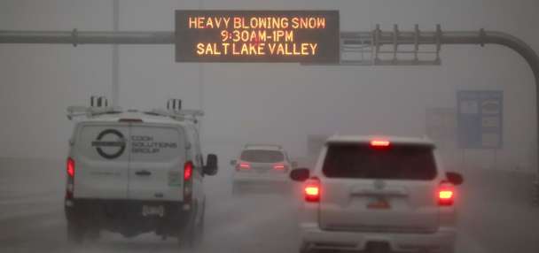 Heavy snow causes delays at airport, snow squall warnings and canyon restrictions
