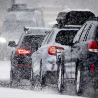 Heavy snow causes delays at airport, snow squall warnings and canyon restrictions